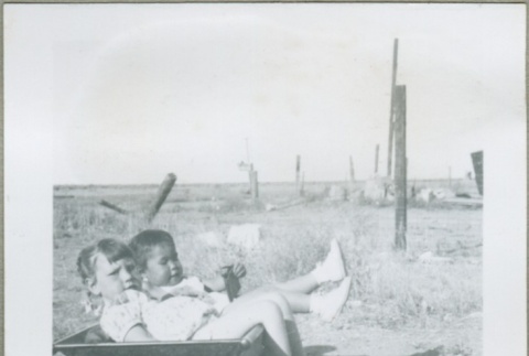 Two girls in a wagon (ddr-densho-300-123)
