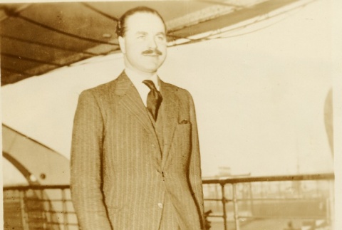 A man walking on the deck of a ship (ddr-njpa-1-1906)
