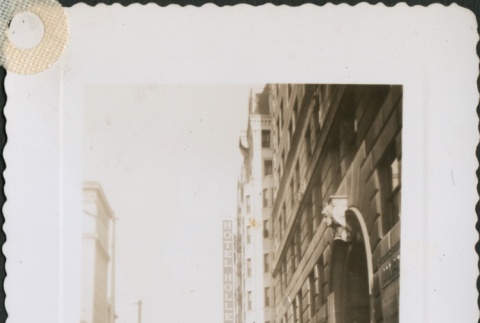 A woman walking down Superior Avenue (ddr-densho-298-159)