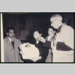 Priest baptizing child (ddr-densho-330-215)