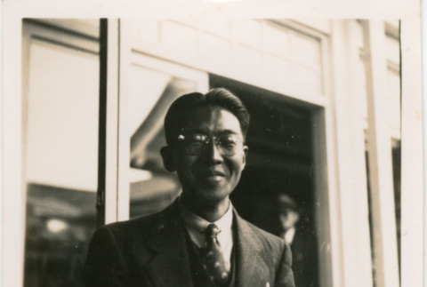 Man standing by open window (ddr-densho-426-1663)