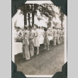 Group of men and women lined up at buffet table (ddr-ajah-2-528)