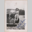 Woman sitting on the front of a truck (ddr-manz-10-28)