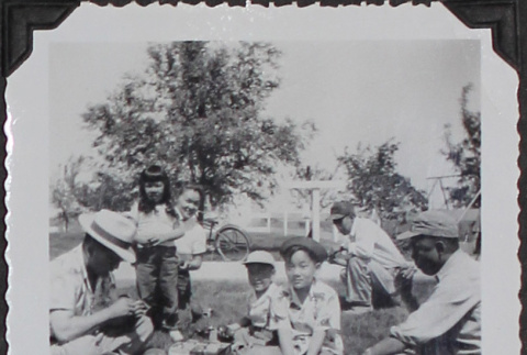 A group sitting in a field (ddr-densho-300-441)