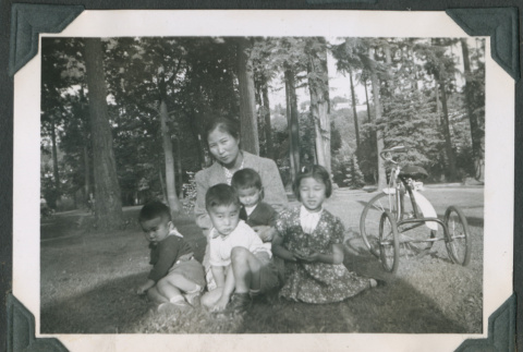 Photo of a woman with four children and a tricycle (ddr-densho-483-905)