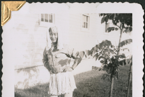 Man dressed in mop wig and skirt (ddr-densho-434-375)