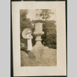 Women with parasol poses by monument (ddr-densho-359-856)