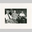 Three seated in white chairs (ddr-densho-1007-254)