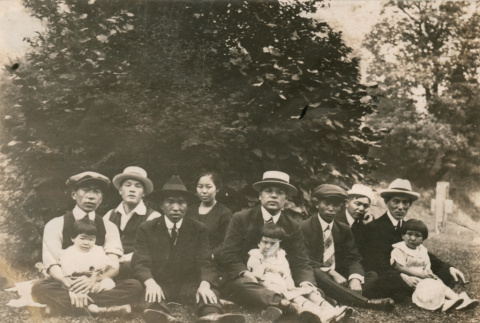 Outdoor group photo of eleven individuals (ddr-densho-348-87)
