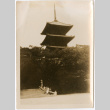 Four people on steps of large pagoda (ddr-densho-426-1527)