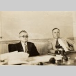 Two men seated behind a desk (ddr-njpa-2-342)