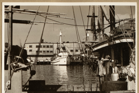 Boat at a dock (ddr-densho-542-779)