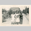 Four girls on sidewalk (ddr-densho-430-184)