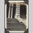 Navy sailor standing on the steps of a building (ddr-densho-432-62)