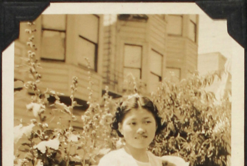 Girl in white dress holding kitten (ddr-densho-423-535)