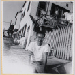 Hardy Shiomi outside house (ddr-densho-522-295)