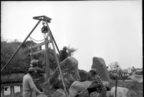 Four men setting boulders at D. Hill Nursery (ddr-densho-377-1424)