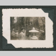Young man in front of bridge (ddr-densho-550-231)