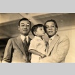 Man holding son, posing with another man (ddr-njpa-4-136)
