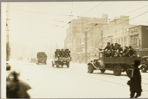 Soldiers riding in trucks (ddr-njpa-13-1224)