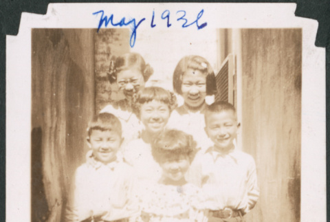 Four girls and two boys in narrow passageway (ddr-densho-483-582)