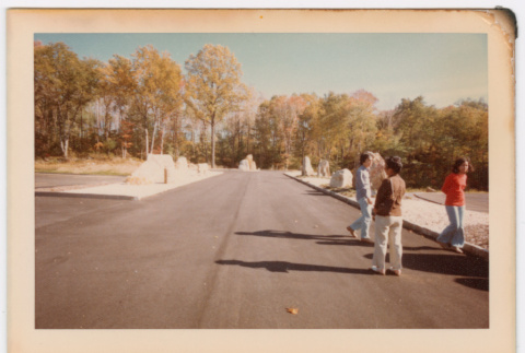 People on road with rock pillars (ddr-densho-377-2184)