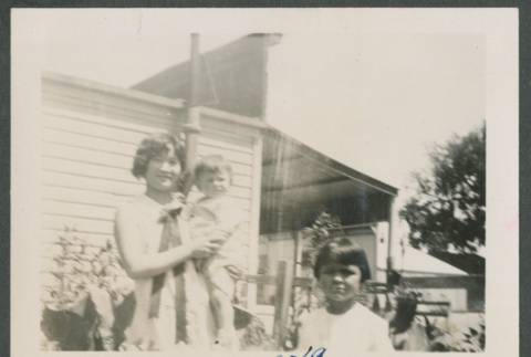 woman holding baby next a young child (ddr-densho-378-730)