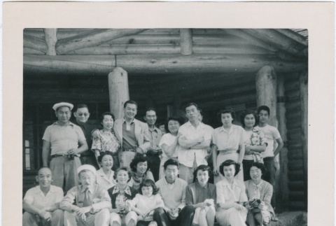 Group photograph in front of a log cabin (ddr-densho-338-274)