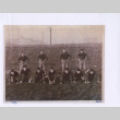 Copy of photo of football team with caption (ddr-densho-430-345)