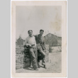 Two men leaning on wall (ddr-densho-329-1326)