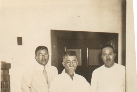 Three men standing for a photograph (ddr-njpa-4-69)