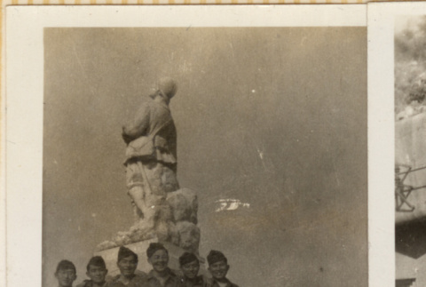 Six men standing on base of statue of soldier (ddr-densho-466-302)