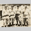 Thornton Lee, Lou Gehrig, Babe Ruth and another baseball player posing in front of the dugout (ddr-njpa-1-1387)