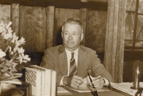 Charles Crane sitting at his desk (ddr-njpa-2-193)