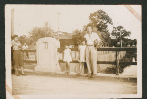 Man and two children on bridge (ddr-densho-550-282)