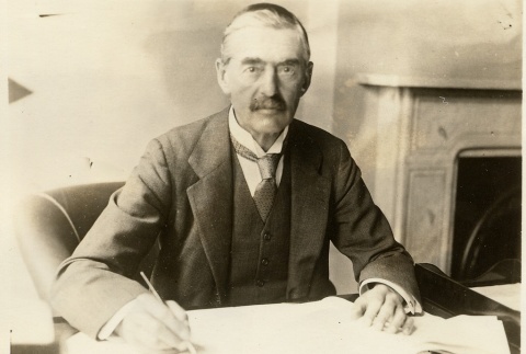 Neville Chamberlain seated at a desk (ddr-njpa-1-15)