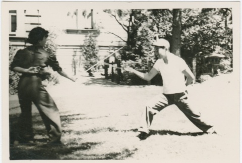 A woman and man fencing (ddr-densho-338-45)