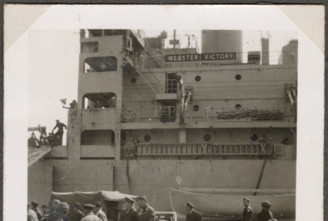 Men standing on dock by ship (ddr-densho-466-19)