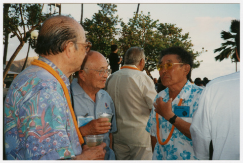 Men talking at luau (ddr-densho-368-433)