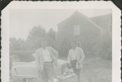 Two men standing near a car (ddr-densho-321-327)
