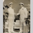 Felix B. Stump and Arthur W. Radford in dress whites, shaking hands (ddr-njpa-2-928)