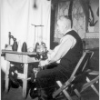 Man using a knitting machine (ddr-densho-2-11)