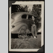 Mits poses with a car (ddr-densho-542-375)