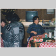 Groups around tables, Martha Suzuki with back to camera (ddr-densho-426-1303)