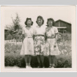 Three women standing outside barracks (ddr-densho-458-60)