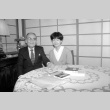 Kiyofumi Kojima and interpreter at table (ddr-densho-1007-577)