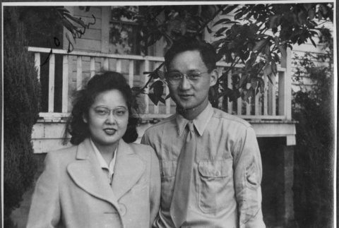 Couple standing outside house (ddr-densho-434-428)