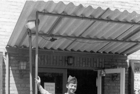 Soldier outside a theater (ddr-densho-91-11)