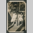 man and two women outside a house (ddr-densho-378-475)