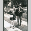 Couple on sidewalk (ddr-densho-523-523)